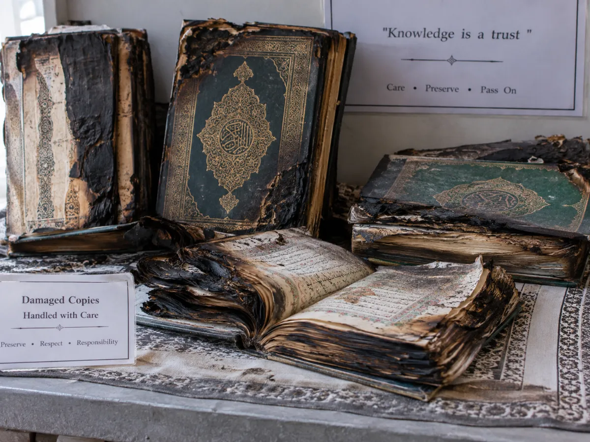 Batch A2 Picture 11 — Partially burned Mus’haf copies preserved for assessment